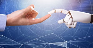 hand touching robot's hand